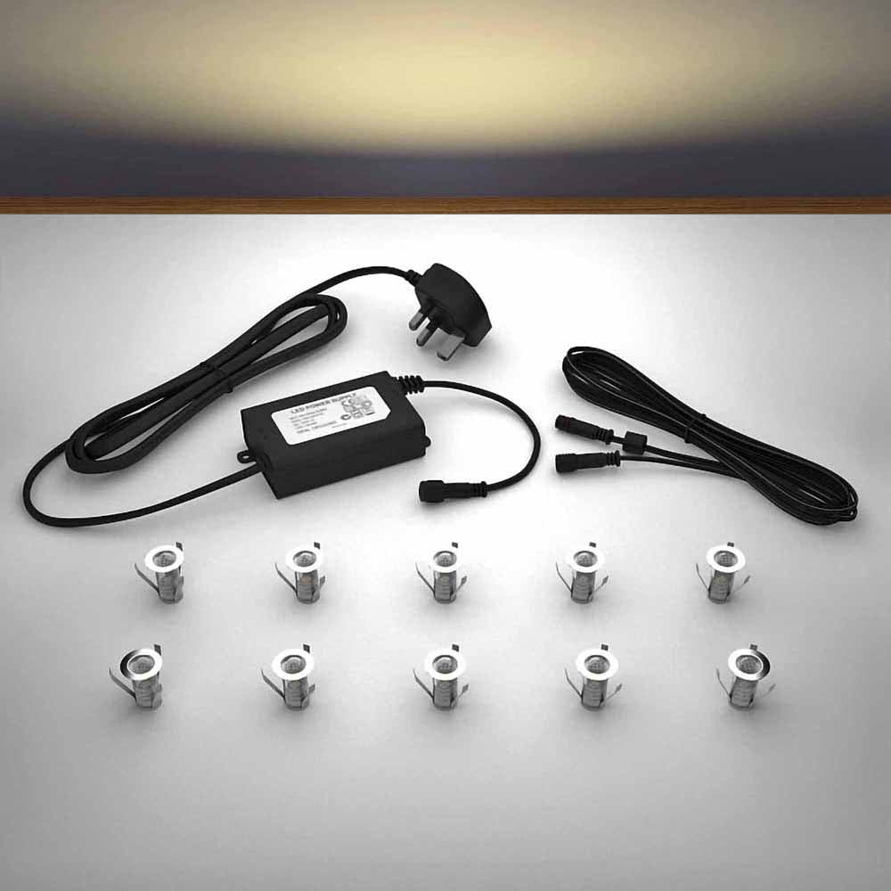 Lighting kit with 18mm warm white LED bulbs and power adapter on a gray surface
