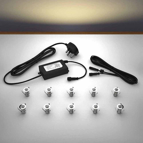 Lighting kit with 18mm warm white LED bulbs and power adapter on a gray surface