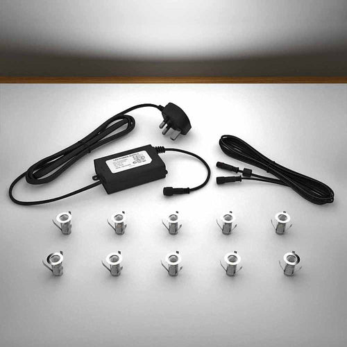 Lighting kit with 18mm white LED bulbs and power adapter on a gray surface