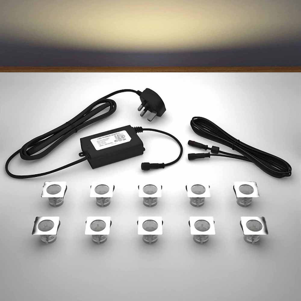 Lighting kit with 30mm square warm white LED bulbs and power adapter on a gray 