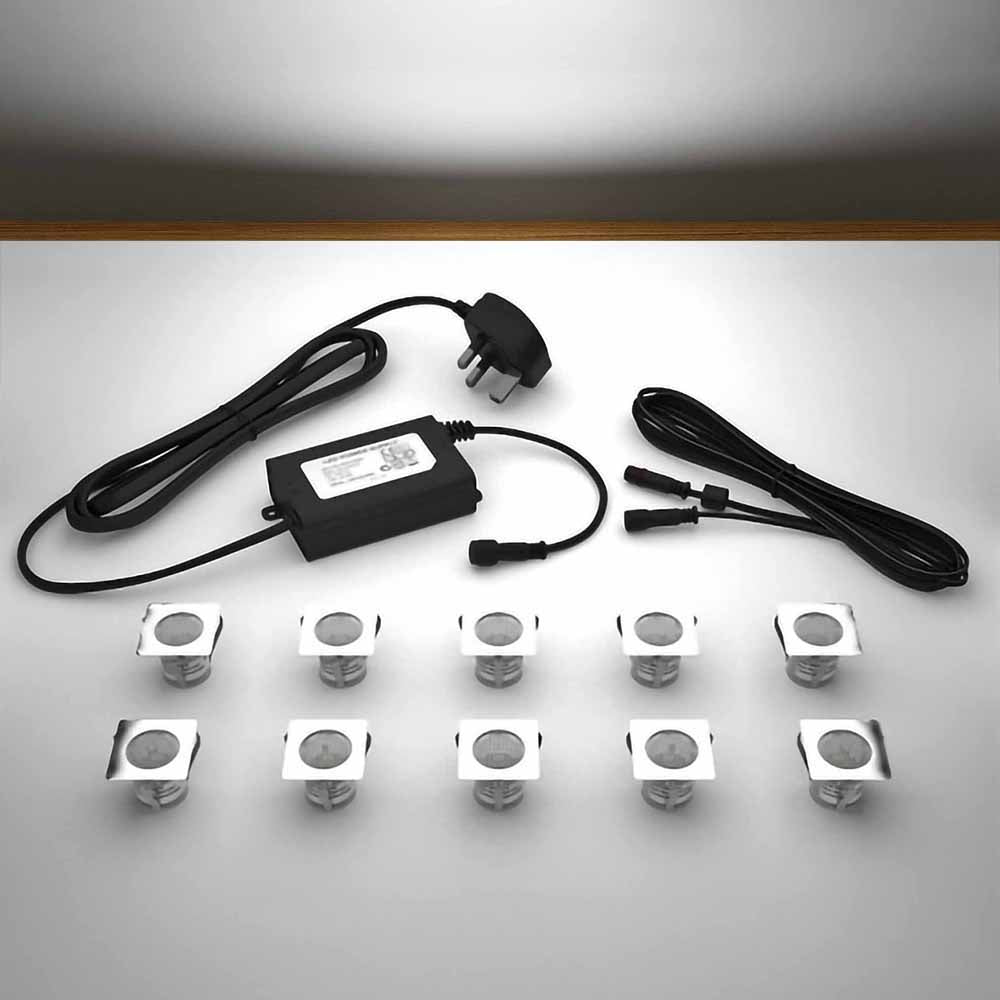 Lighting kit with 30mm square white LED bulbs and power adapter on a gray 
