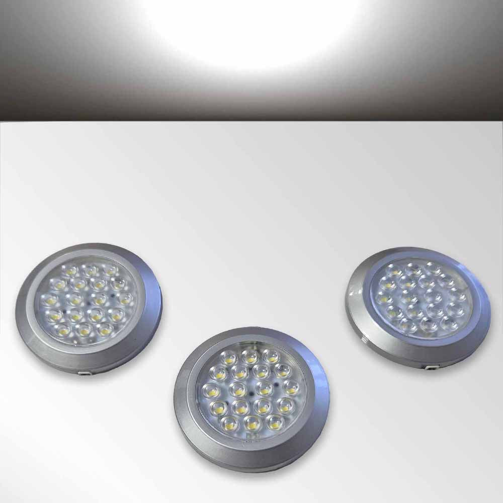 Three circular white LED kitchen cabinet lights with silver rims on a white background