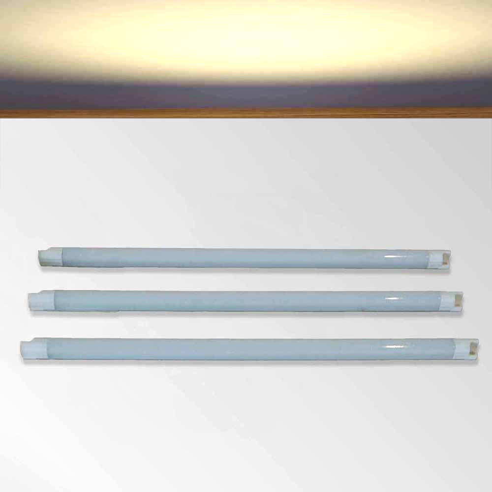 Three LED kitchen cabinet warm white strip lights on a white background