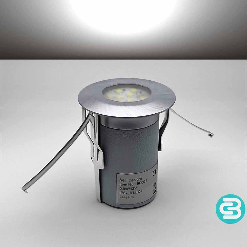 White LED deck light fixture on a gray background