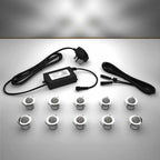 Domed lighting kit with 30mm white LED bulbs and power adapter on a gray surface