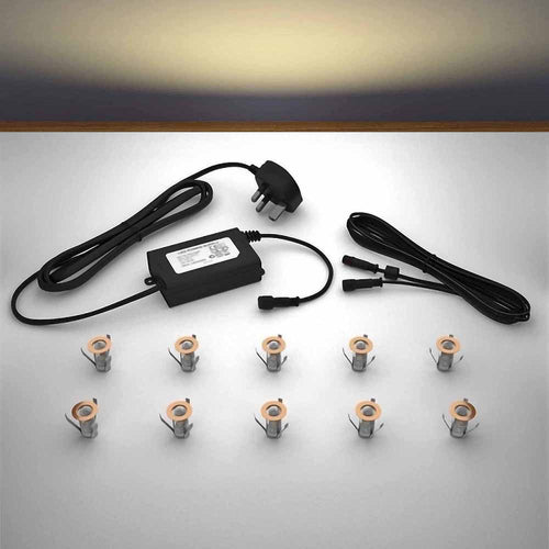 Copper lighting kit with 18mm warm white LED bulbs and power adapter on a gray surface