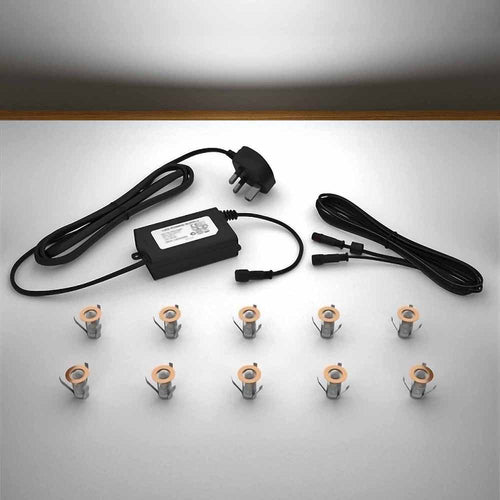 Copper lighting kit with 18mm white LED bulbs and power adapter on a gray surface