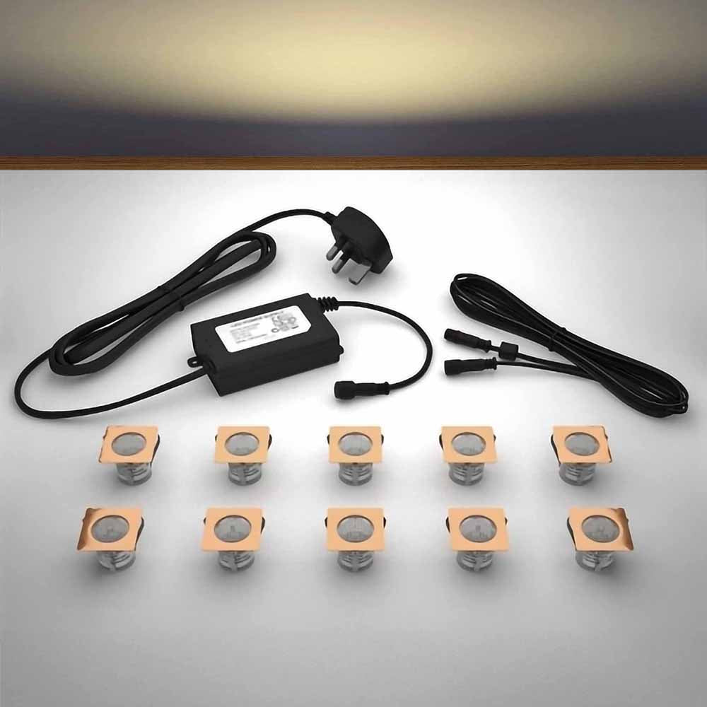 Copper square lighting kit with 30mm warm white LED bulbs and power adapter on a gray surface