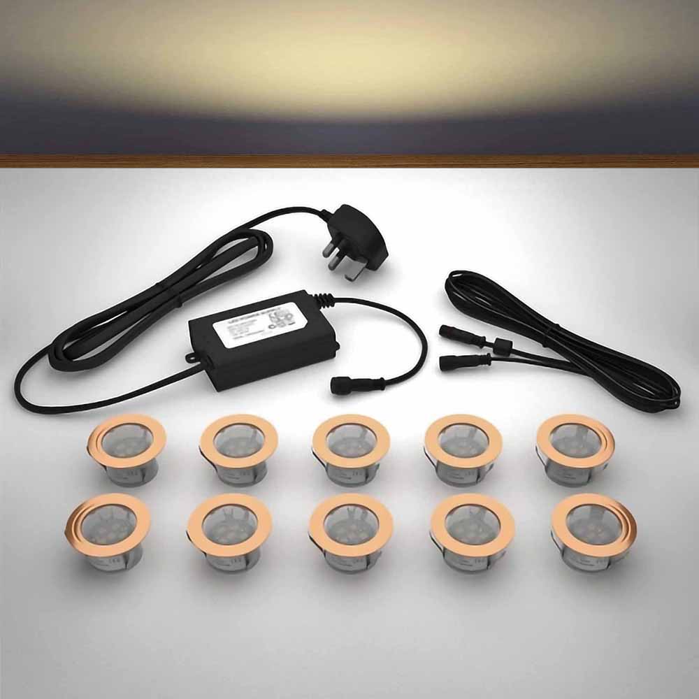 Copper lighting kit with 45mm warm white LED bulbs and power adapter on a gray surface