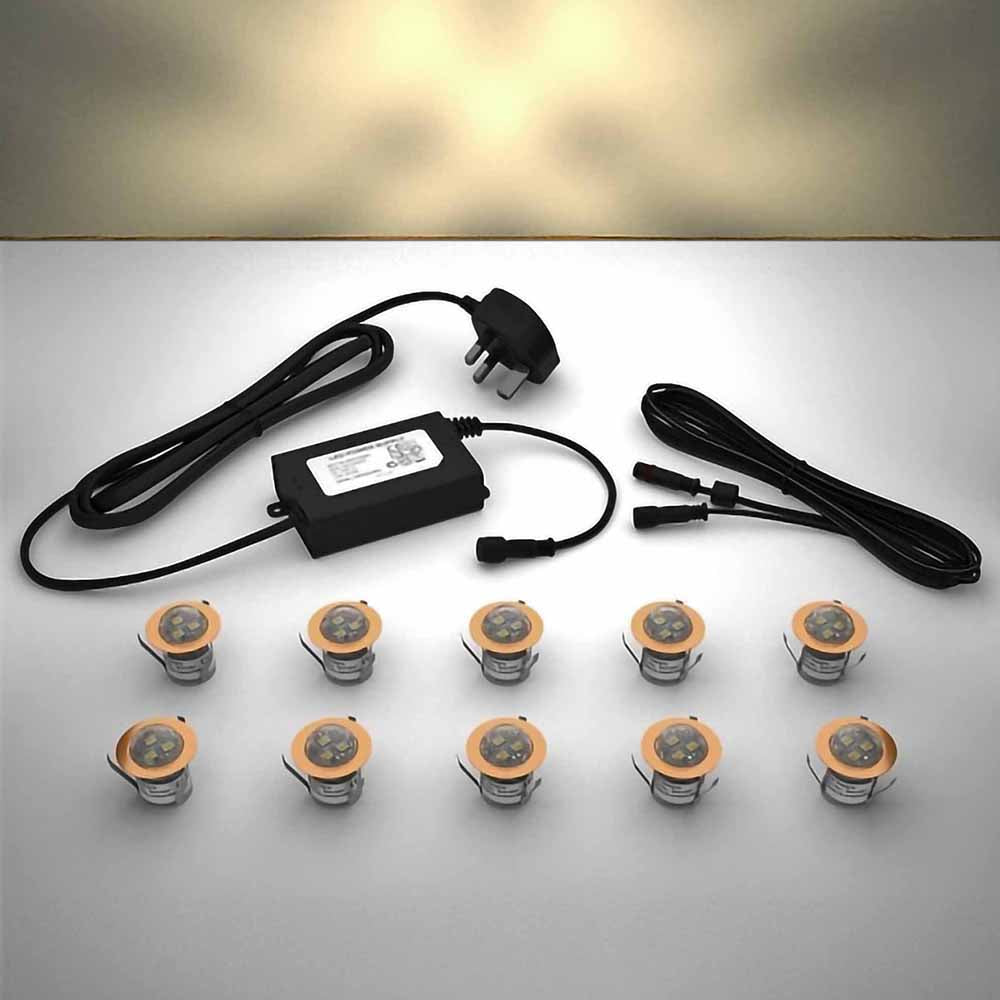 Copper domed lighting kit with 30mm warm white LED bulbs and power adapter on a gray surface