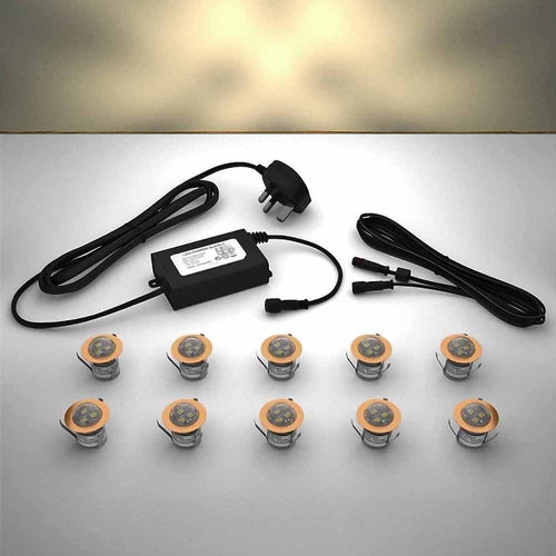 Copper domed lighting kit with 30mm warm white LED bulbs and power adapter on a gray surface