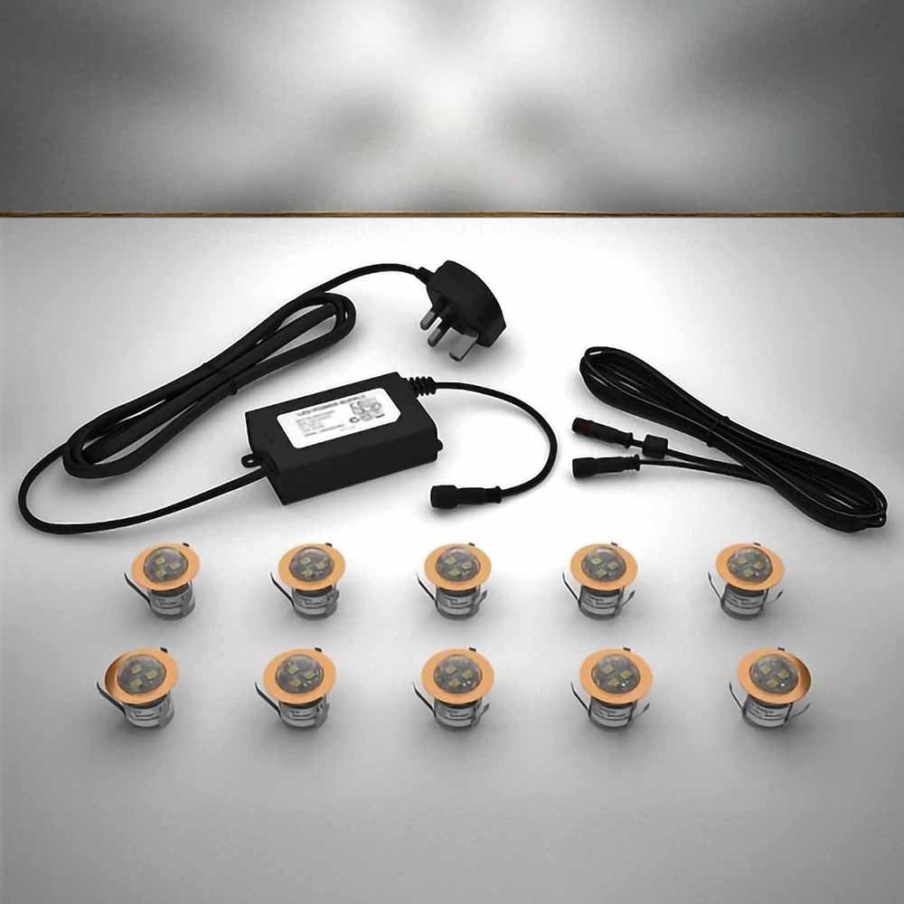 Copper domed lighting kit with 30mm white LED bulbs and power adapter on a gray surface