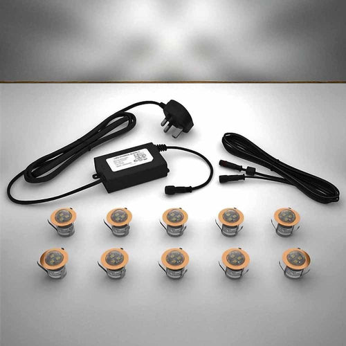 Copper domed lighting kit with 30mm white LED bulbs and power adapter on a gray surface