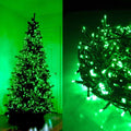 Green LED string lights on a Christmas tree and coiled on a surface.