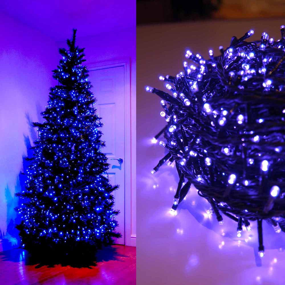 Ultra violet LED string lights on a Christmas tree and coiled on a surface.